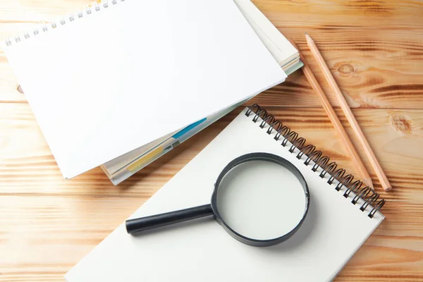 Magnifier Notebook Pen Wooden Desktop — Stock Photo, Image