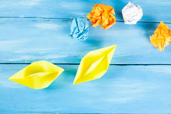 Yellow Paper Boats Wads Paper Blue Wooden Background — Stock Photo, Image