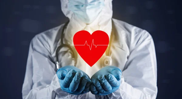 healthcare concept. The doctor protects the heart on a blue background