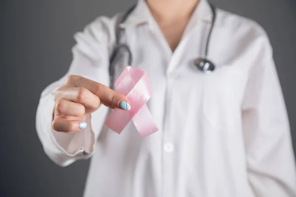 Doctor Holds Pink Ribbon His Hand Gray Gray Background — Stock Photo, Image