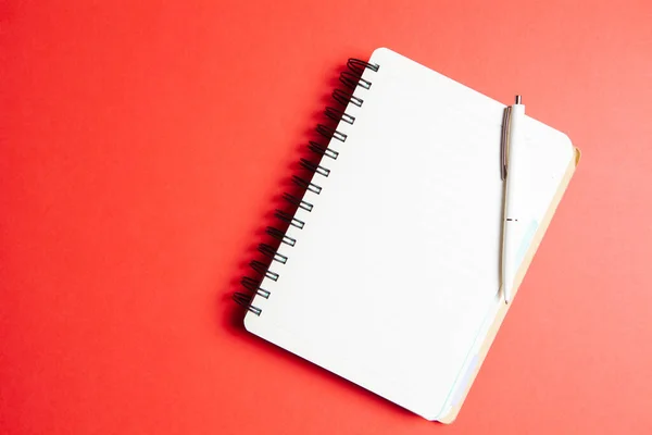 Notebook Pen Red Background — Stock Photo, Image