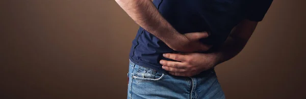 Man Has Stomach Ache Brown Background — Stock Photo, Image