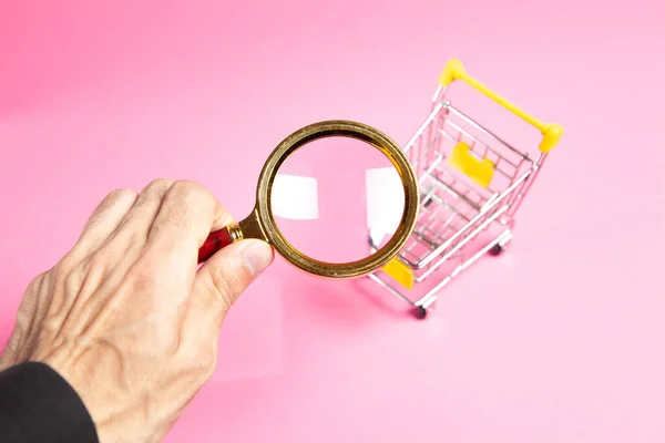 Trolley Magnifier Pink Background Shopping Search Concept — Stock Photo, Image