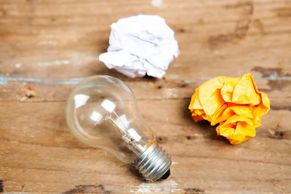 Crumpled Papers Light Bulb Wooden Table — Stock Photo, Image