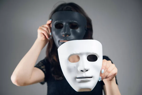 Woman Holding Black White Plastic Mask Gray Background — Stock Photo, Image