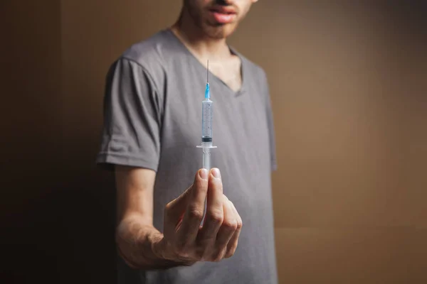 Man Holding Syringe Addiction Concept Brown Background — Stock Photo, Image