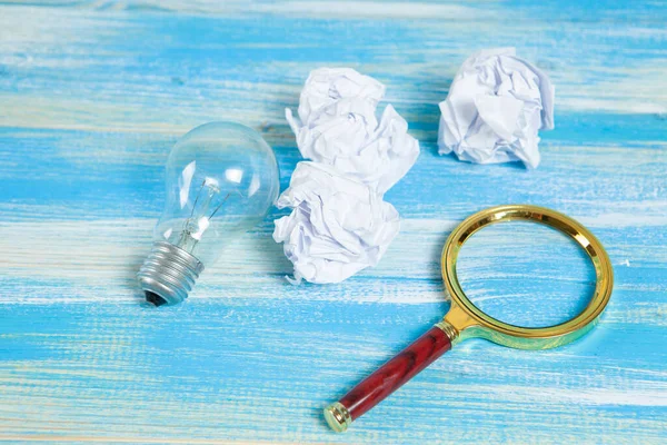 Light Bulb Crumpled Papers Magnifying Glass Concept Search Ideas Trash — Stock Photo, Image
