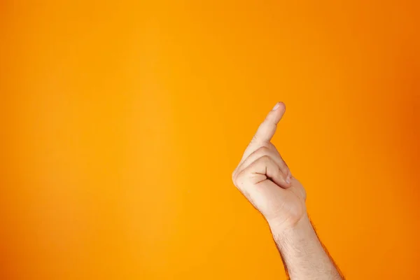 Hand Shows Middle Finger Orange Background — Stock Photo, Image