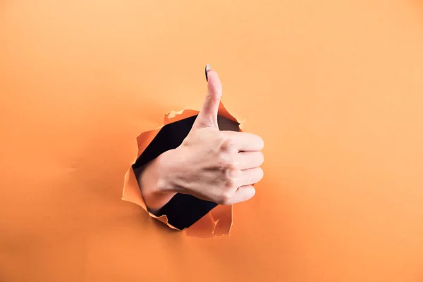 Female Hand Showing Thumb Orange Background — Stock Photo, Image