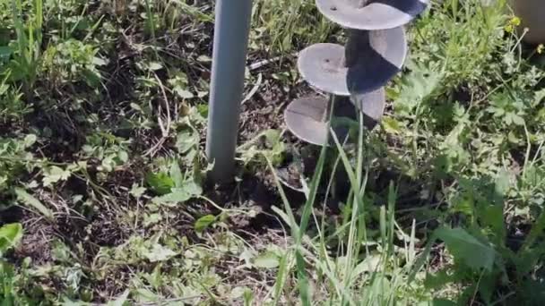 Drilling a hole in the ground with a drilling tool yourself — Video