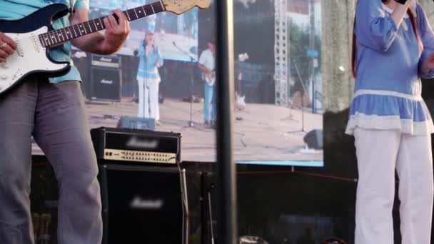 Concert of a group of musicians on the street stage. — Stock Video