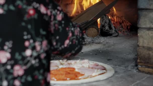 Cooking pizza in a wood-fired oven. — Stock Video