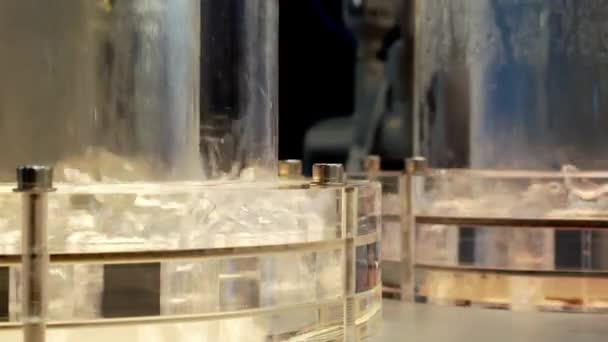 Two transparent flasks with a geyser. — Stock Video