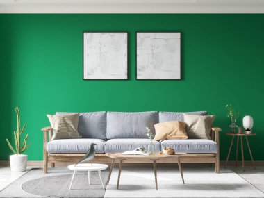 Çarpıcı yeşil aksanlı duvarı olan canlı bir oturma odası gri yastıklı açık ahşap bir kanepe ve iki soyut beyaz sanat eserinin yer aldığı minimalist bir estetik..