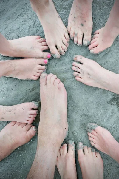 feet on mont saint michel bay sand