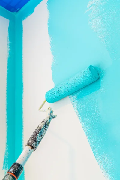 Paint roller, blue paint — Stock Photo, Image