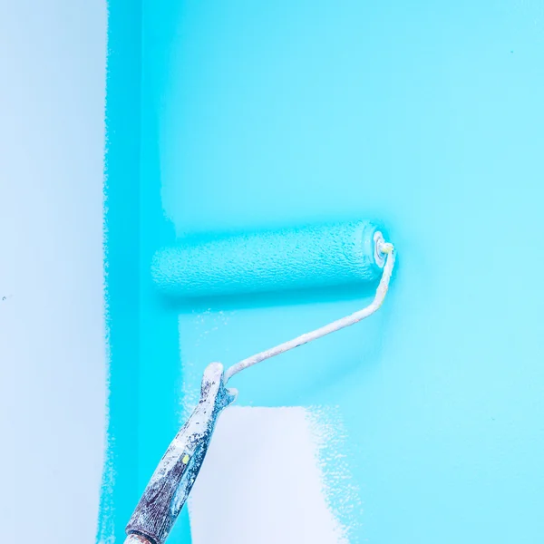 Paint roller, blue paint — Stock Photo, Image