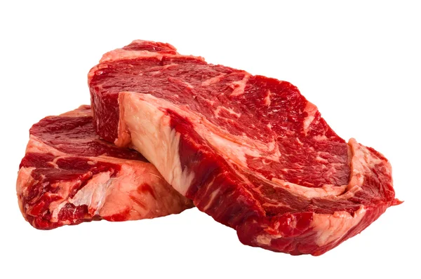 Ribeye steaks geïsoleerd op witte achtergrond — Stockfoto