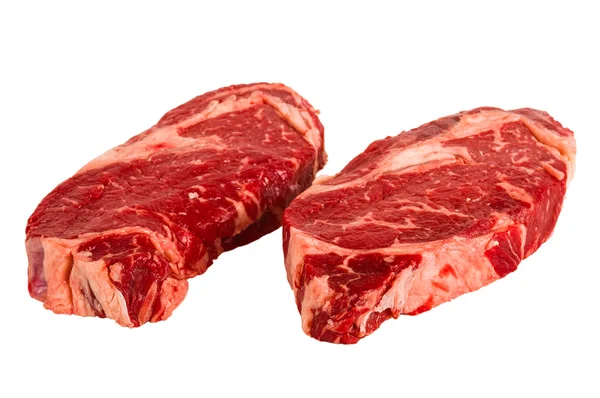 Ribeye steaky izolovaných na bílém pozadí — Stock fotografie