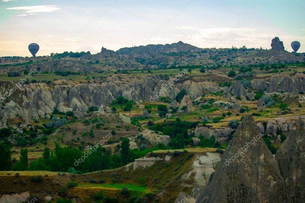 Cappadocia - Turkey, Hot air balloons in the sky at morning time, tourism at Turkey, view of the valley - Goreme - Nevsehir 