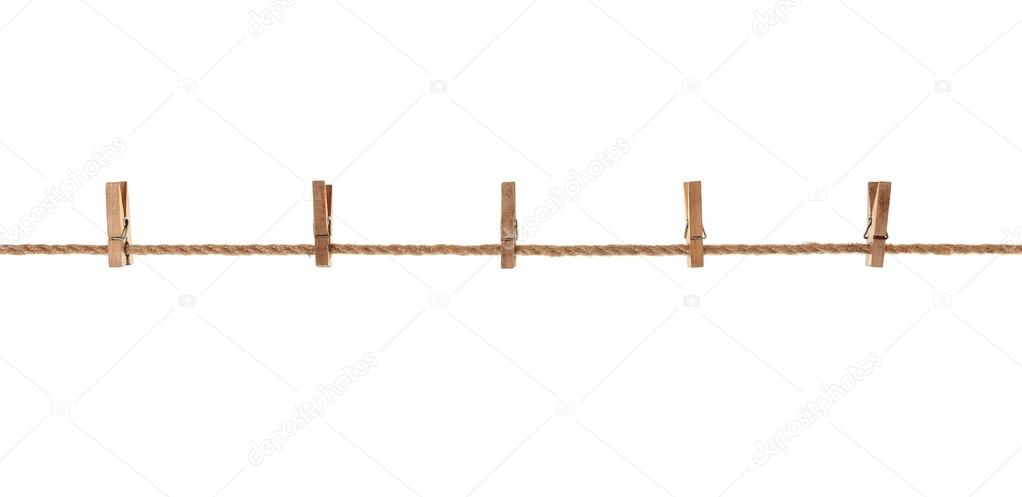 wood, old clothes pegs hanging on a rope. On white background