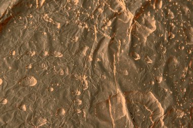 Bronz doku, arka plan. Soyut, kopyalama spazmı. Bulanık, su damlaları.