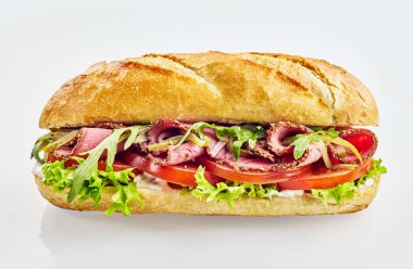 Baguette sandwich with roast beef, tomato and mixed salad clipart