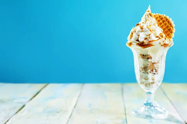 Delicious Hazelnut Ice Cream Sundae Rustic Table Blue Background Copy — Stock Photo, Image
