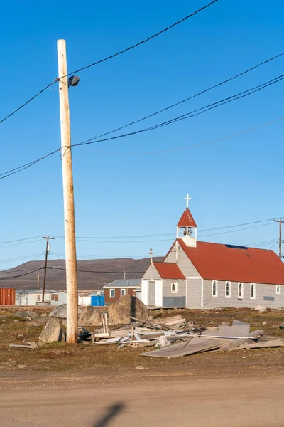 Small anglican church in the Canadian arctic in the golden hour. St. Michael and All Angels Church in remote Inuit community of Qikiqtarjuaq, Broughton Island, Nunavut. The north.