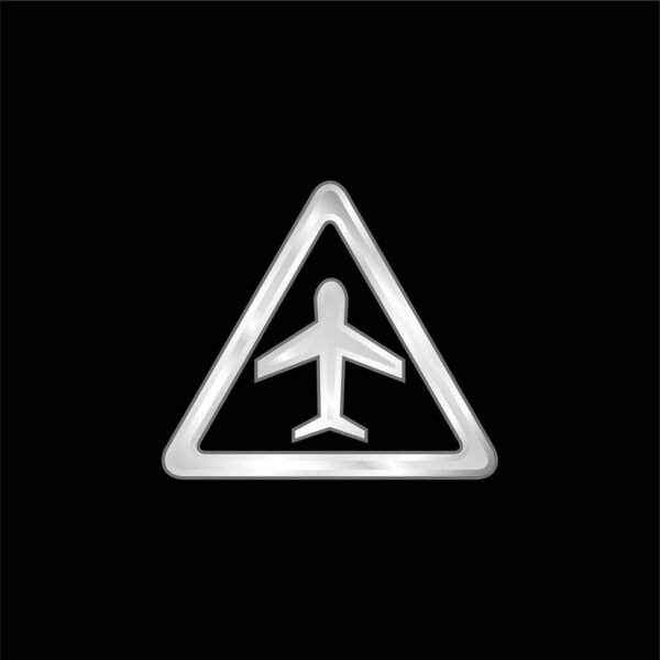 Треугольный сигнал о серебристом металлическом значке самолета