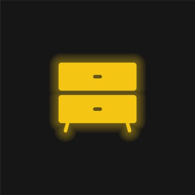 Yatağın yanındaki masa başı sarı parlak neon simgesi