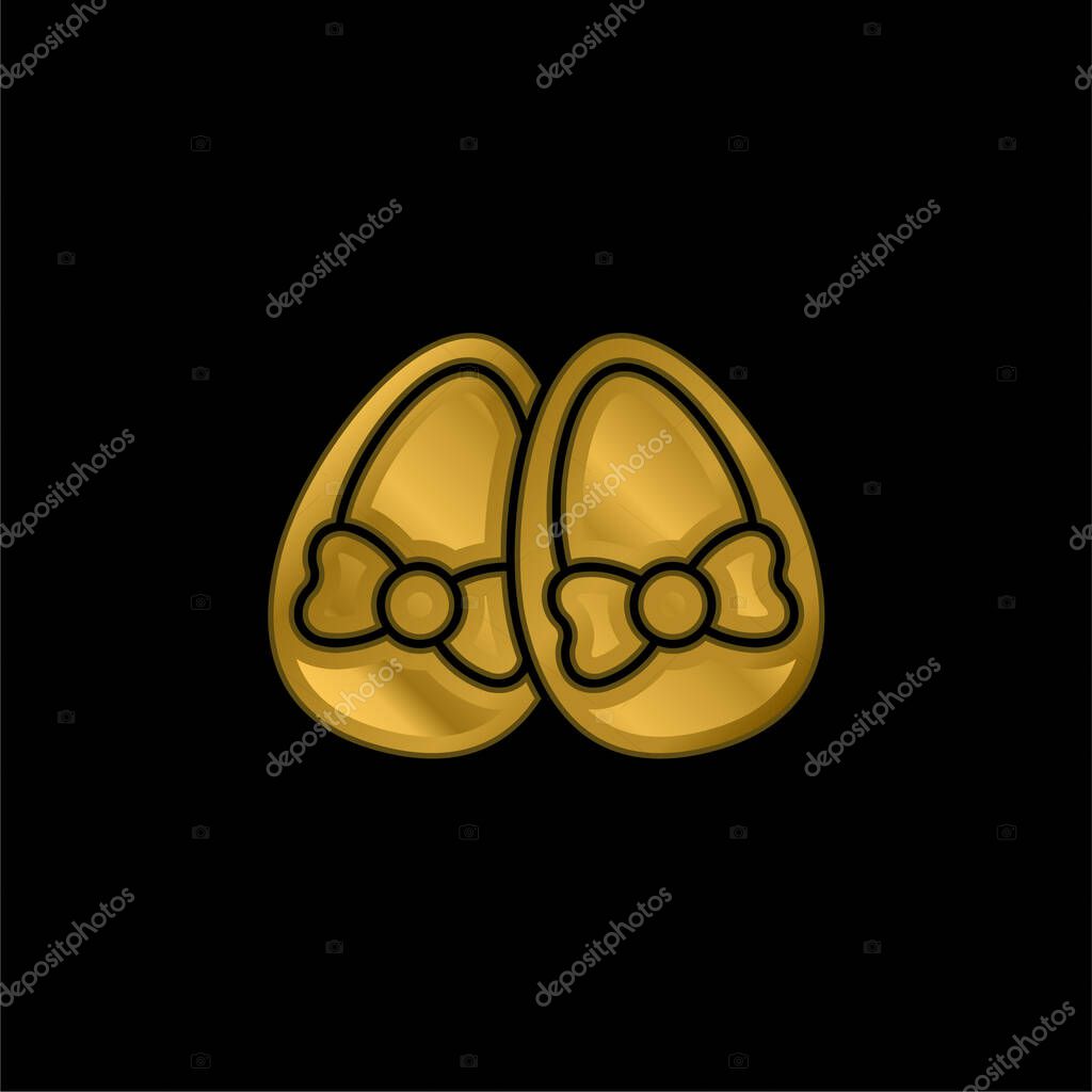 Baby Shoes gold plated metalic icon or logo vector