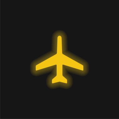 Parlayan sarı neon simgesini gösteren uçak