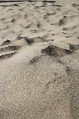 Kum tepeleri. Kum dokusu arkaplanını kapat.