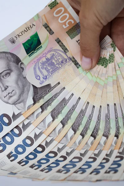 Ukrainian money in a hand. Ukrainian 500 banknotes closeup. — Stock Photo, Image