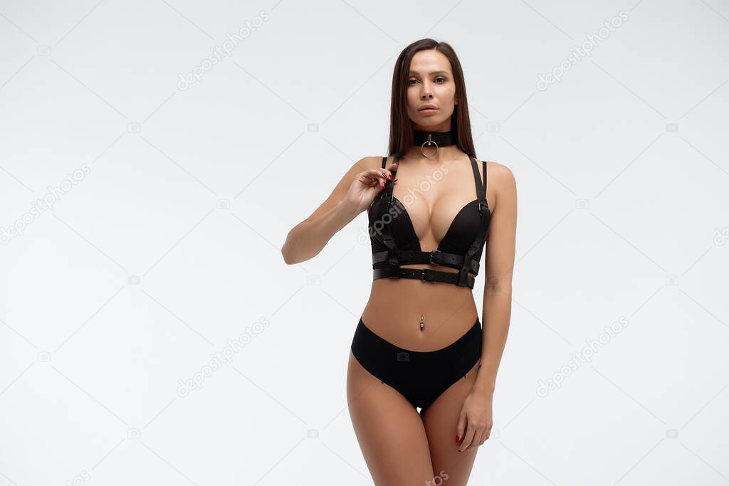 Crop view of attractive erotic young woman in lingerie crossing hands