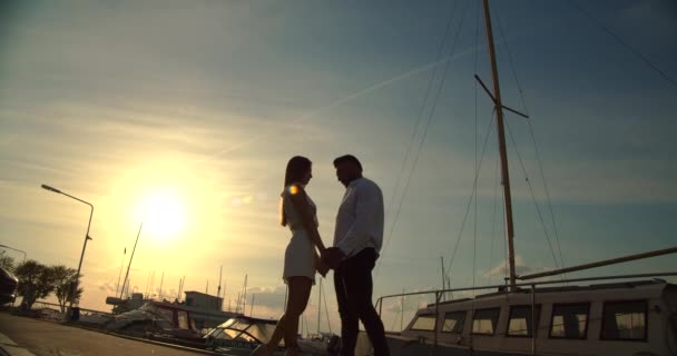 Romantic couple having date on embankment at sunset — 图库视频影像