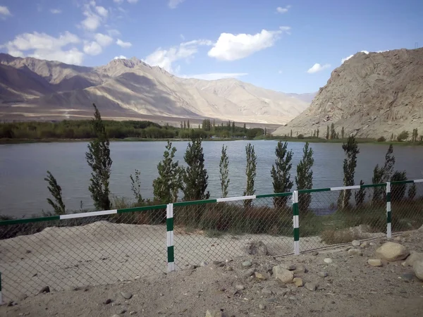 River Lined Young Trees Metal Fence Surrounded Bare Mountains Ladakh — Stock Photo, Image