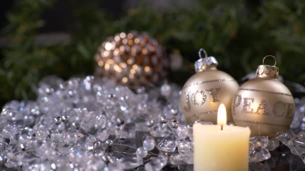 Close Candle Lit Joy Peace Christmas Balls Background — Stock video