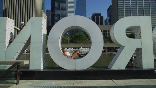 Girl Relaxing Toronto Sign — Stock Video