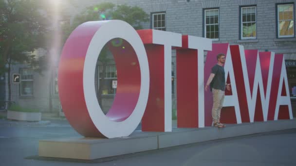 Man Taking Pictures Ottawa Sign — Stock video