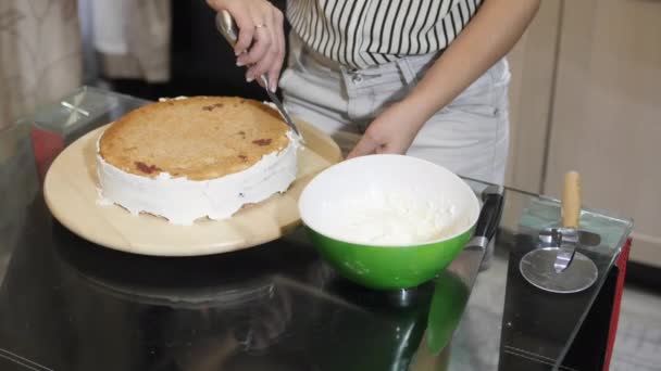 Woman Icing Cake — Stock Video