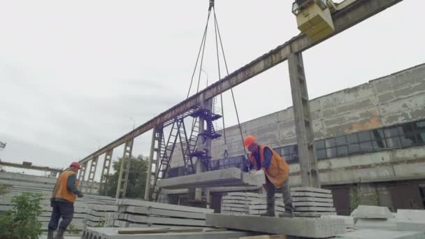 Lifting Concrete Square Bars Using Crane — Stock Video