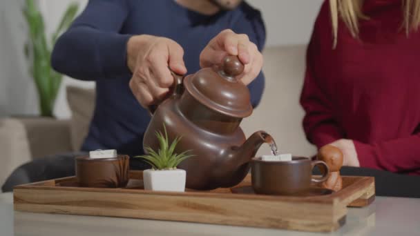 Cropped Footage Man Pouring Tea Woman Sitting — Stock Video