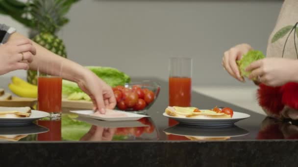 Two Women Preparing Sandwiches — стоковое видео