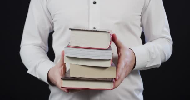 Person Holding Books Hands — Stockvideo