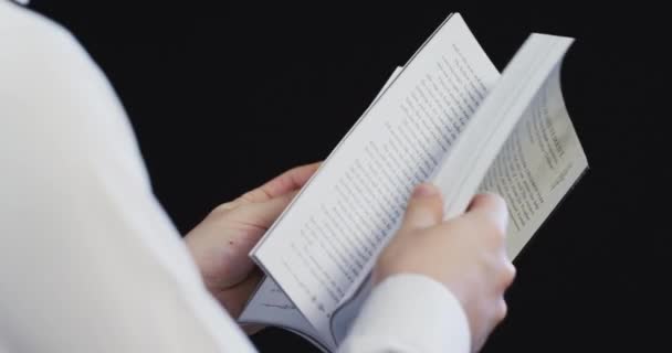 Person Browsing Book — Vídeos de Stock