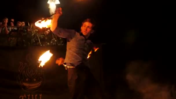 Young Man Spinning Fire Staffs — Stock Video