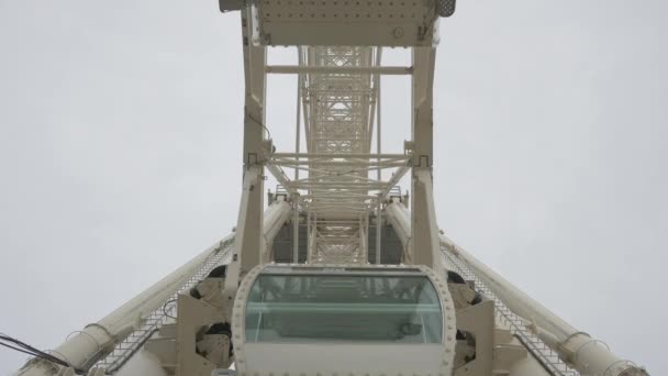 Low Angle Ferris Wheel Capsules Rotating — Stock Video