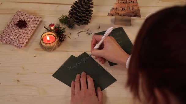 Unrecognizable Woman Writing Christmas Wishes — Stock Video